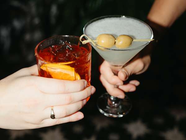 Friends enjoying a cocktail toast at Casa Bella...cheers! 