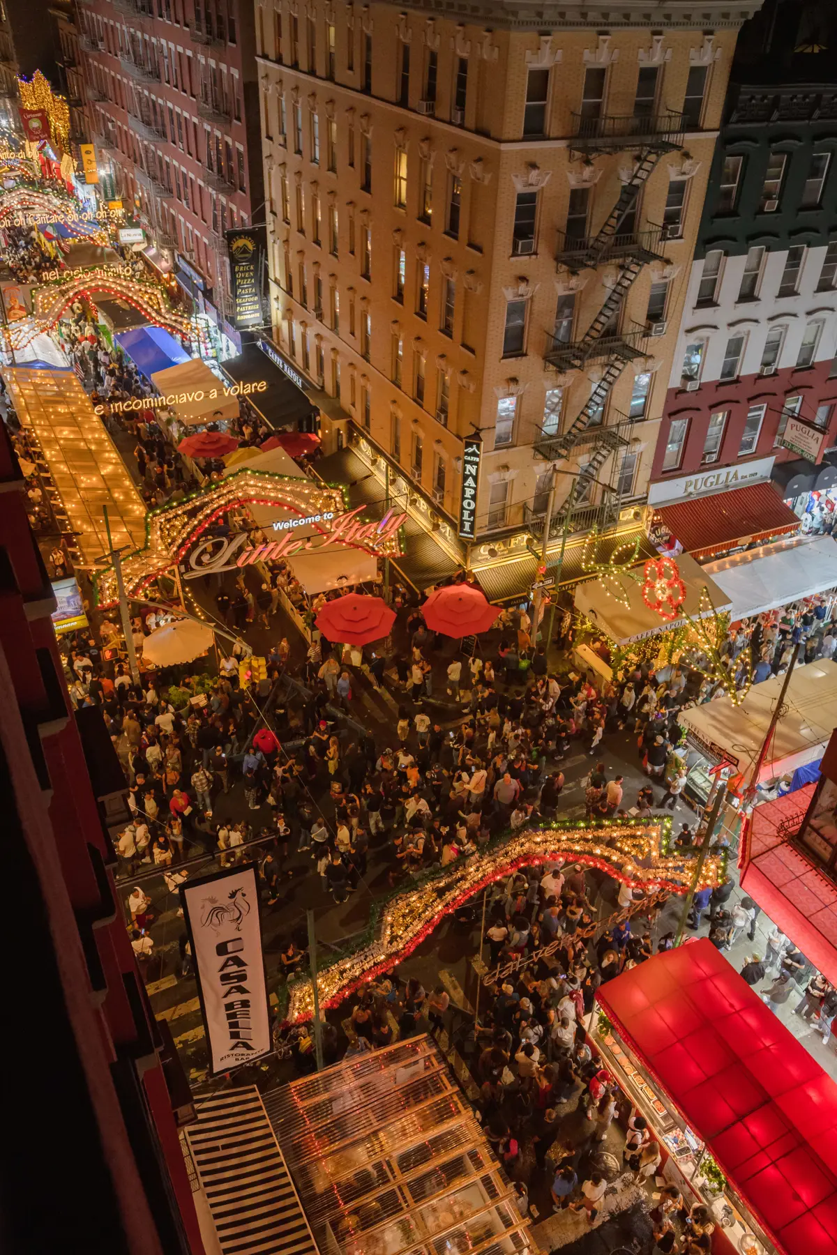 Friends gathering outside on the street near Casa Bella in NYC. 